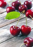 Freshly washed cherries on a wooden table