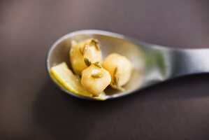 Chick-peas with cumin on a spoon