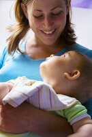 Mother holding baby in her arms