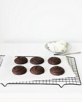 Chocolate Whoopie Pies (halves) on a cooling rack