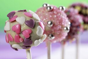 Cake pops, chilled and decorated with sugar strands