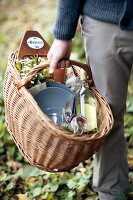 A man carrying a picnic basket