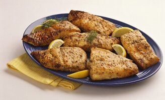 Salmon Fillet on a Platter with Lemon and Dill