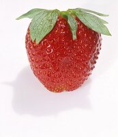 A Single Wet Strawberry on a White Background