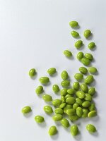 Edamame Scattered on a White Surface