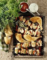 Grill rack with kebabs and chicken legs