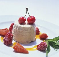 Nut semifreddo with berries and cherries