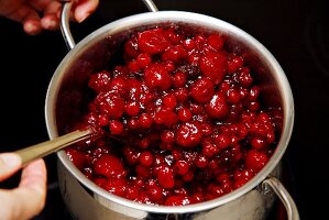 Red berry compote in a pan