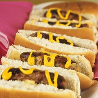 Hot dog with mustard and onions