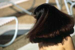 Rear view of woman with long dark hair