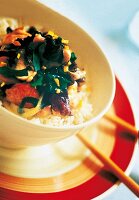 Close-up of stir fried chicken with mushrooms in bowl