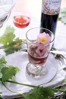 Moscato pink sorbet decorated in glass with a wild rose