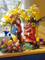 Flowers in vases made with mache paper in the form of Easter bunny