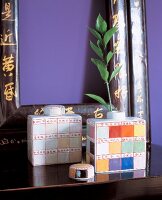 Two lid cans of earthenware with Chinese decor on table