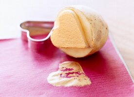 Close-up of potato stamp with cut-out love heart shape