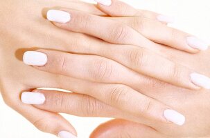 Close-up of woman's fingers wearing fake finger nails