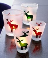 Frosted lanterns glasses with red and green moose