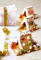 House shaped gingerbread cookies decorated with butter and cream
