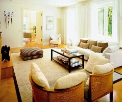 Beige coloured living room with furniture and cushions