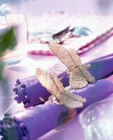 Purple napkins with butterfly napkin rings