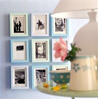 Close-up of pictures framed in wooden frame on wall
