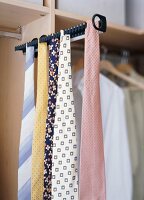 Close-up of tie hanging on rack