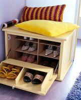 Decorative pillows on Yellow Shoe cabinet with woman shoes
