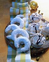 Vanilla crescents with cream and chocolate on plate
