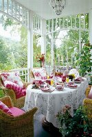 Set up of dining table in pink and white shades in garden