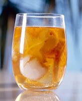 Punch with exotic fruits in glass