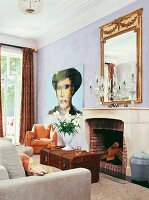 Interiors of room with antique mirror, painting and old chest in front of fire place