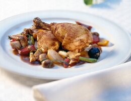 Close-up of sauteed bresse poulard with peppers on plate