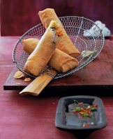Spring rolls with vegetable filling on grid