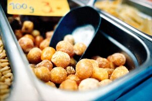 Close-up of macadamia nuts on market stall