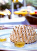 Close-up of apple tart with meringue and quince jelly on plate