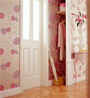Room with floral wallpaper and wall cabinet