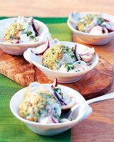 Close-up of dumplings with mushrooms and onions in bowls