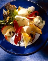 Close-up of raw vegetables and fruits on plate