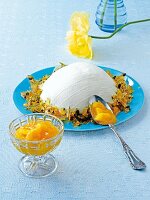 Quark cream with mango compote on blue plate