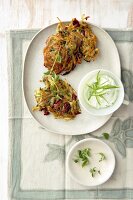 Two marjoram potato pancakes with curd cheese on plate