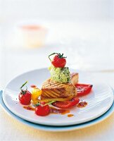 Grilled swordfish with basil puree on plate