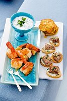 Shrimp corn, tuna and corn fritters on serving dish