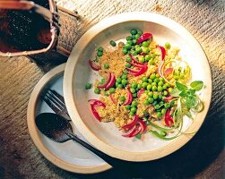 Risotto peas, onions and quinoa in bowl