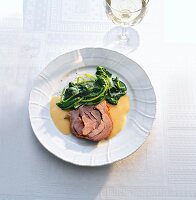 Turkey thigh with lemon on plate