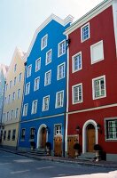 Facade of colourful houses and street in Passau, Germany