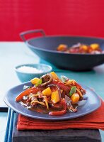 Beef with mango on plate
