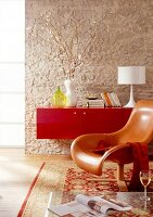 Living room with red lacquer sideboard and leather chair on carpet