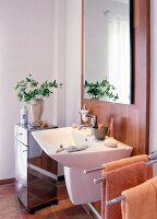Bathroom with mirror, sink and wooden panels