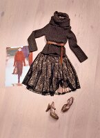 Knit sweater with turtleneck and sandals on wooden floor