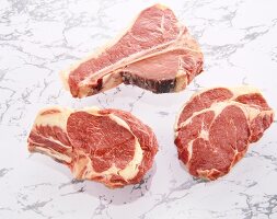 Three raw steaks